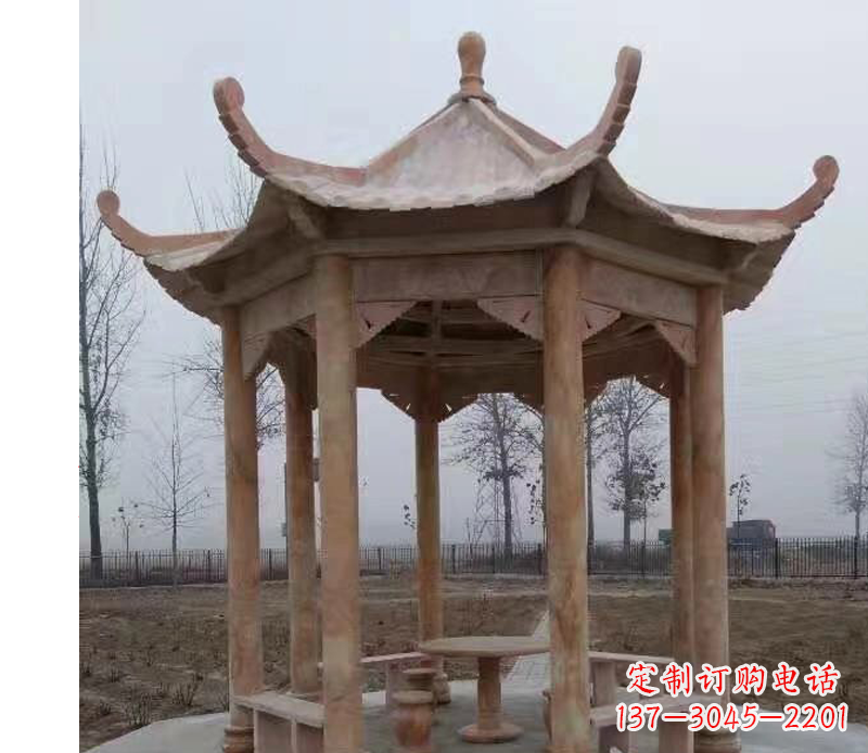 天津公园晚霞红八角石雕凉亭